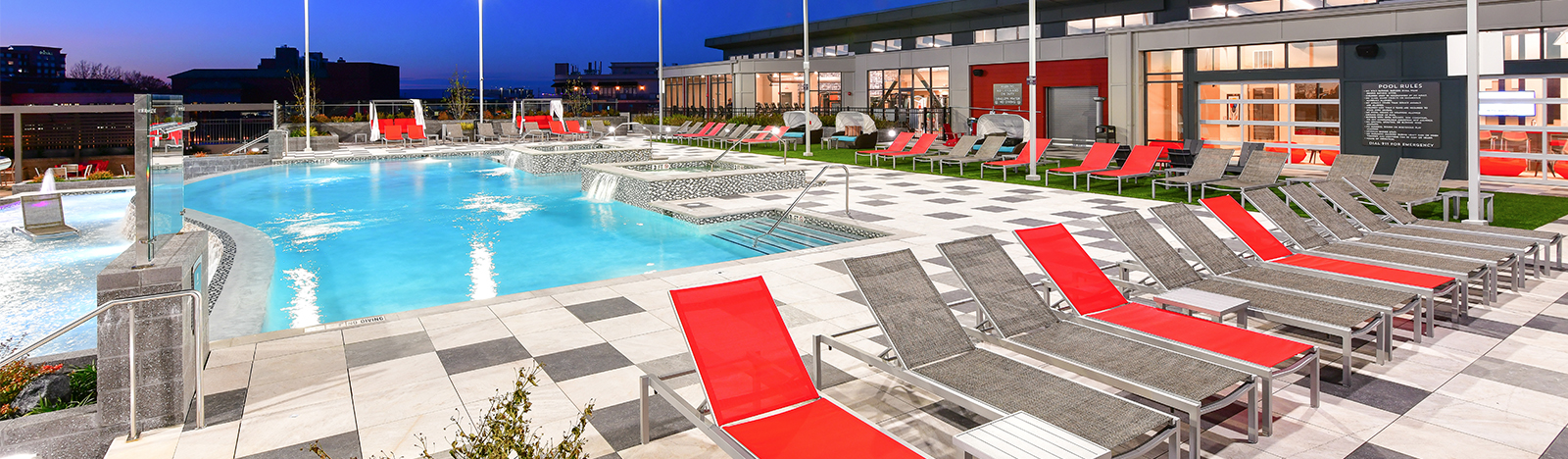 Resort style pool surrounded by lounge chairs