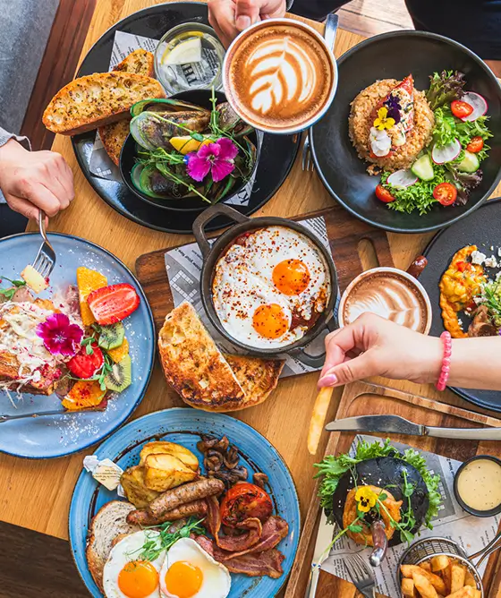 table covered in breakfast dishes